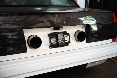 rain light bracket universal garagistic bmw e30 e36 license plate frame racecar track car 